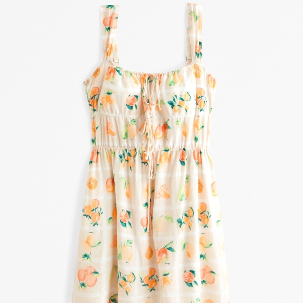 BNWT Orange and peach print sleeveless tie front dress